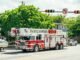City of Miami fire-rescue truck with dive team module on a sunny street.